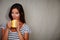 Charismatic lady holding coffee cup while standing