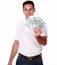 Charismatic man standing and holding dollars