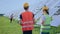 Charismatic young lady and guy technician workers at solar power farm they analysing the operation of sun and