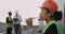 Charismatic young woman engineer African ethnic drinking some water on the rooftop of construction site she wearing a