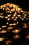 Charity. Praying candles in a temple.