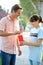 Charity Worker Collecting From Man In Street