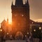 Charles Bridge at dawn: silhouettes of Old Bridge Tower, churches and spires of Old Prague