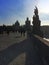 Charles Bridge, silhouettes of people and buildings on the waterfront