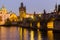 Charles Bridge and Vltava river in Prague in dusk at sunset