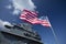 Charleston, South Carolina, United States, Novemner 2019, us flag the stars and stripes with the uss yorktown ship
