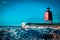 Charlevoix, MI /USA - March 3rd 2018:  Charlevoix Michigans South Pier Lighthouse frozen over in winter