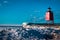 Charlevoix, MI /USA - March 3rd 2018:  Light house frozen over in Charlevoix Michigan