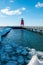 Charlevoix, MI /USA - March 3rd 2018: Melting ice sheets near the light house in Charlevoix Michigan