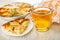 Charlotte in mold, napkin, slice of pie in saucer,  cup of tea with lemon on wooden table