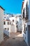 The charm of the small Spanish town of Altea - narrow streets with white houses under the southern sun. Spain, Apr.2019