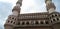 Charminar inside Hyderabad, which big pillars are made with very good design and blue sky in the back side.