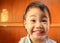 Charming 3 years old Asian Thai little girl smilling at home