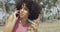 Charming black girl speaking on phone in sunlight