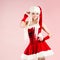 Charming blond woman in Christmas outfit. Red Santa suit with hood.