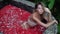 Charming brunette woman posing on camera at outdoors spa