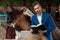 Charming businessman holding a book and looking forward