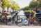 Charming canal with boat houses and bicycles in Amsterdam old town, Netherlands. Popular travel destination and tourist attraction