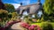 A charming cottage with a thatched roof and a colorful garden in full bloom.