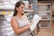 Charming curvy woman shopping at home goods store