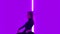 Charming dancer in black leotard performing acrobatic contemp dance elements against the backdrop of bright neon lights