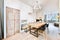 Charming dining room with a crystal chandelier