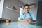 Charming female doctor using mobile phone in clinic