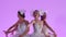 Charming feminine ballerinas are dancing in a white swan costume. A group of young women gracefully moves in slow motion