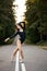 charming fit Caucasian woman ballerina on the pointy shoes and black suit dancing