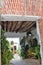 Charming footpath full of plants in Frigiliana, Spanish white village Andalusia