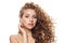 Charming healthy model with natural make-up, shiny clear skin and long curly hairstyle showing her ear with diamond jewelry