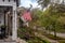 Charming home facades with flags in Savannah, Georgia on a cloudy day