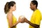 Charming interracial couple wearing yellow football shirts holding ball between each other, profile angle white studio