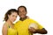 Charming interracial couple wearing yellow football shirts, hugging friendly while posing for camera holding ball, white