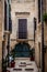 Charming Italian Balconies: Old Buildings Adorned with Balconies in a Typical Polignano a Mare Street