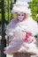 Charming italian woman in Venetian pink costume mask dress