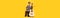 Charming little boy, funny musician wearing huge oversize clothes playing guitar, having fun isolated over yellow