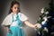 Charming little girl decorates a Christmas tree