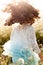 Charming little girl with developing curly hair