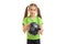 Charming little girl in green shirt with soccer ball in hands