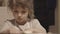 Charming little girl making biscuits at the kitchen table