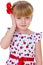 Charming little girl with red rose in hair braided