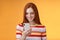 Charming modern redhead girl college student checking message box holding smartphone look happy smiling delighted