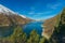 Charming mountain lake, white peaks and blue sky