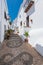 Charming narrow historic streets of white village Frigiliana.