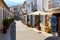 Charming narrow street with souvenir shops of a Guadalest. Spain