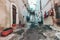 `Charming Neighborhood: Street with Laundry Hanging to Dry