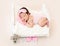 Charming newborn with pink sleep mask