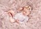 Charming newborn wearing lace suit