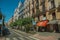 Charming old buildings with shops and people in Madrid